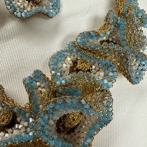 Tricia Milaneze Lavish beaded necklace and clip earrings set. Very unique.